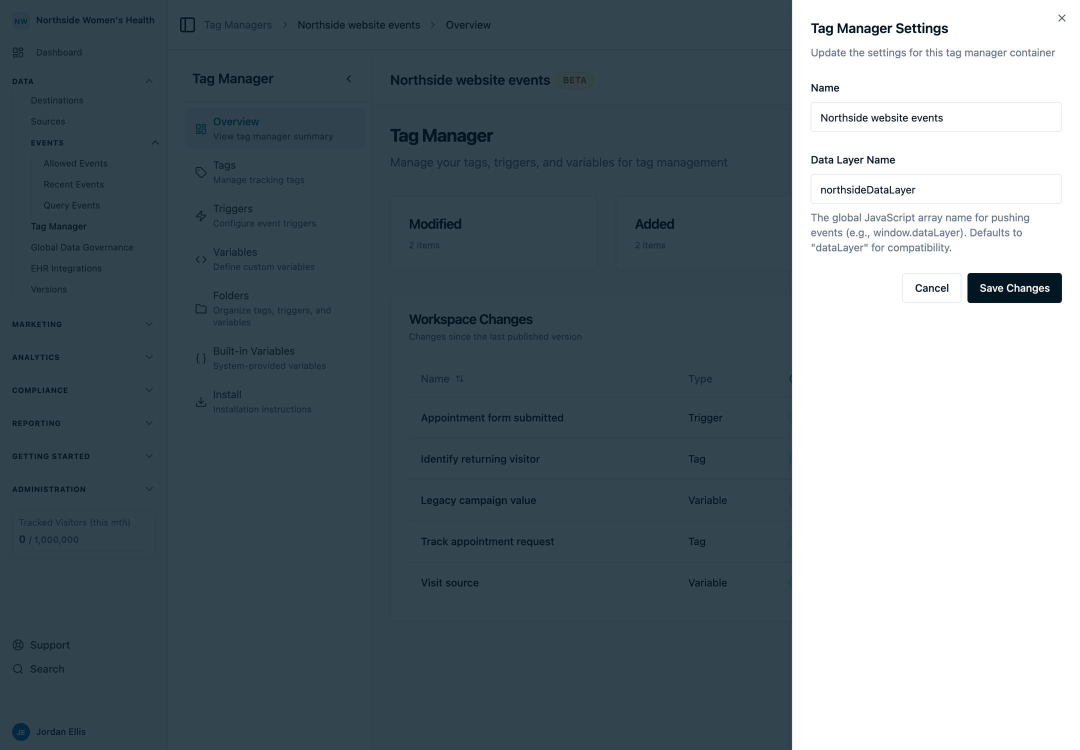 The Tag Manager settings panel with the Data Layer Name field used to keep the container aligned with the website's JavaScript data layer.